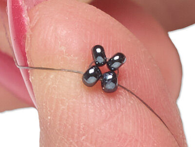 Four beads on thread